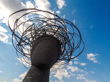 Low angle view of spiral tower against sky