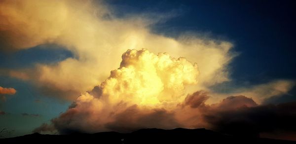 Low angle view of silhouette mountain against sky during sunset