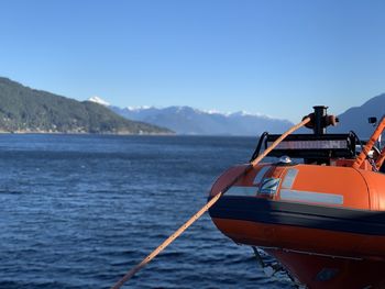 Sailboat on sea against clear sky