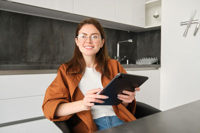 Young woman using digital tablet