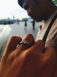 Close-up of man holding hands