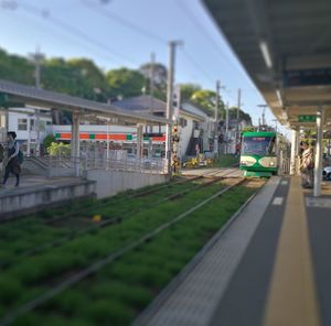 Train at railroad station against sky