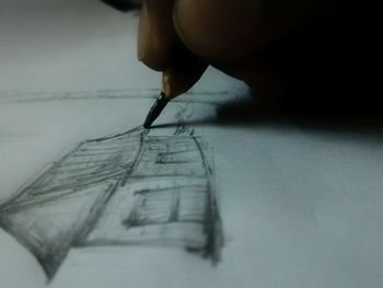 Close-up of human hand holding paper