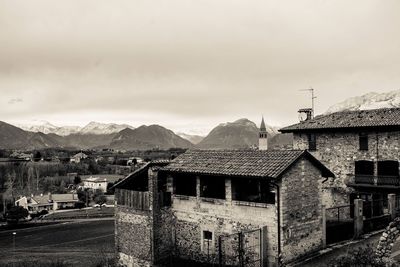 Houses in town against sky