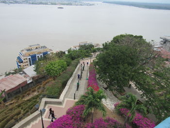 High angle view of swimming pool by buildings in city