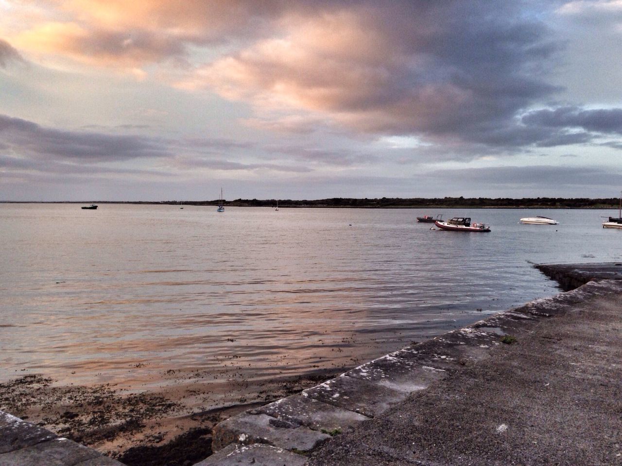 water, sky, nautical vessel, sea, transportation, cloud - sky, mode of transport, boat, cloudy, tranquility, tranquil scene, moored, scenics, beauty in nature, cloud, nature, shore, beach, idyllic, horizon over water