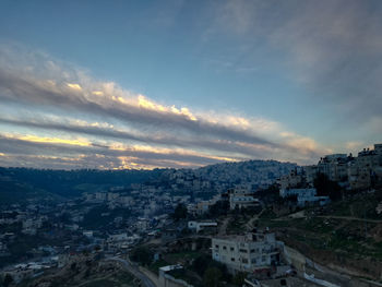 High angle shot of townscape against sky at sunset