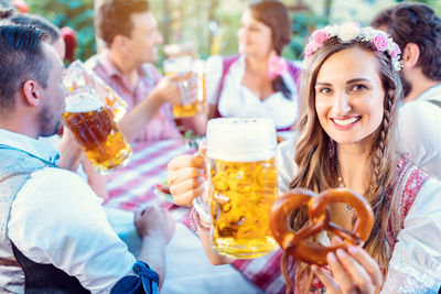 Young woman drinking glasses outdoors