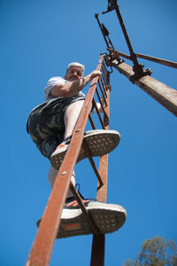 Portrait of man climbing stairs