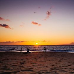 Scenic view of sea at sunset