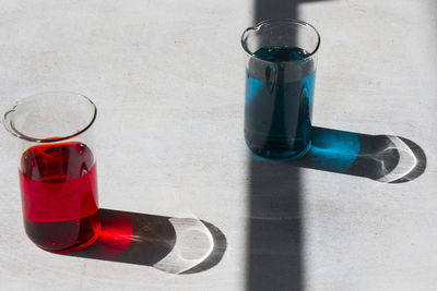 High angle view of glass bottle on table