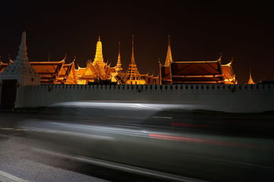 View of illuminated temple against clear sky at night