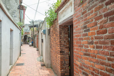 Narrow alley amidst residential buildings