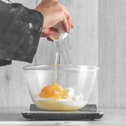 Midsection of man preparing food in kitchen