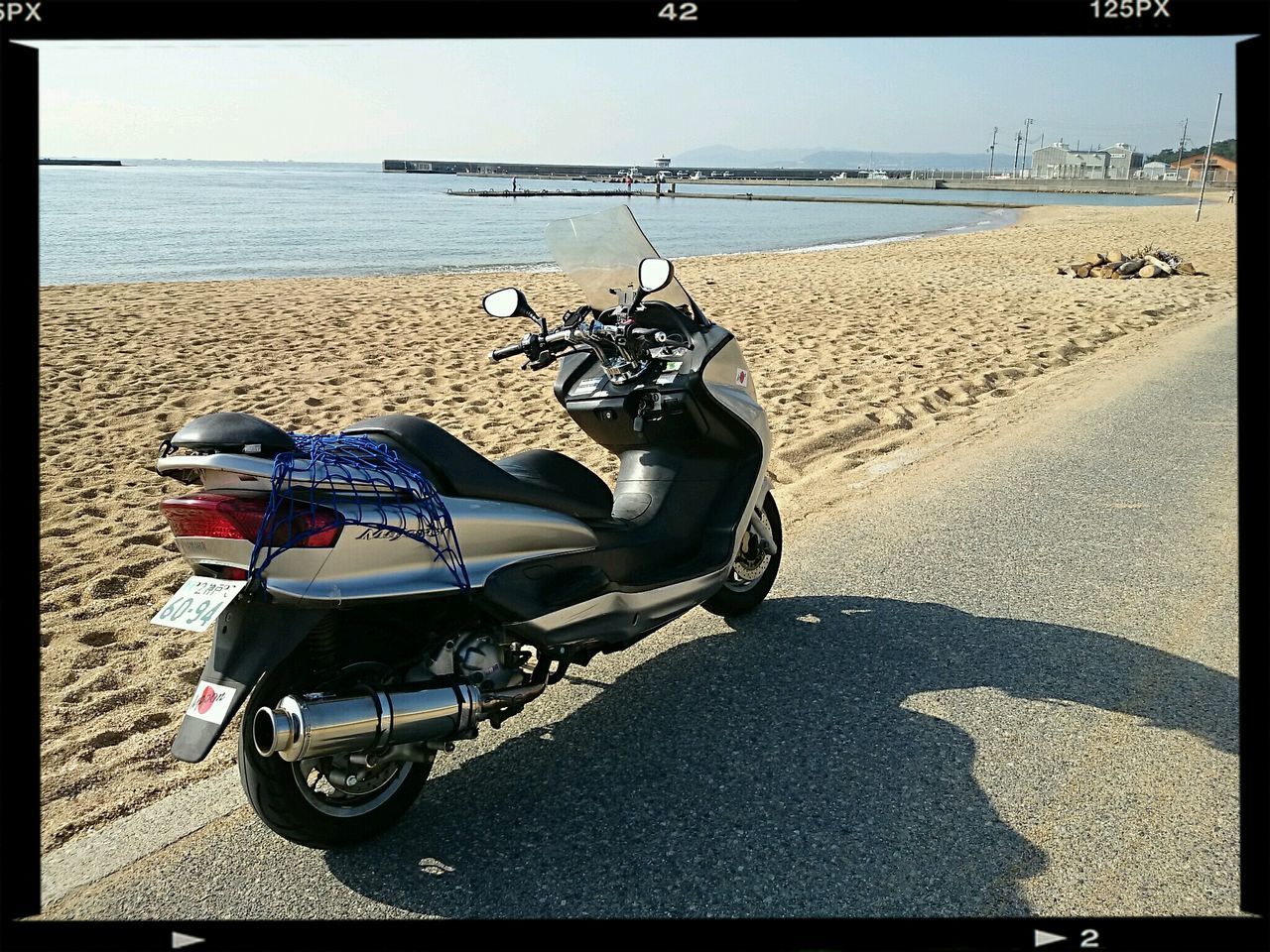 beach, sea, transfer print, sand, shore, water, horizon over water, auto post production filter, shadow, sunlight, bicycle, transportation, tranquility, nature, sky, day, mode of transport, outdoors, tranquil scene, beauty in nature