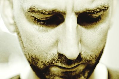 Close-up portrait of a serious young man