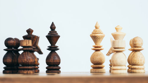 Close-up of chess board against white background