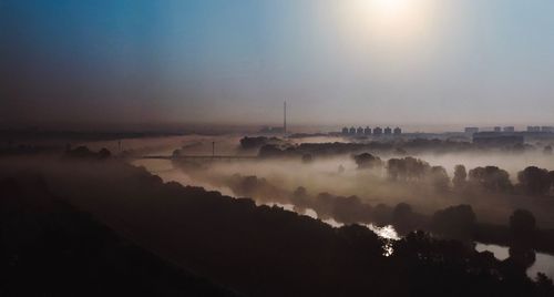 Scenic view of landscape against sky during sunset