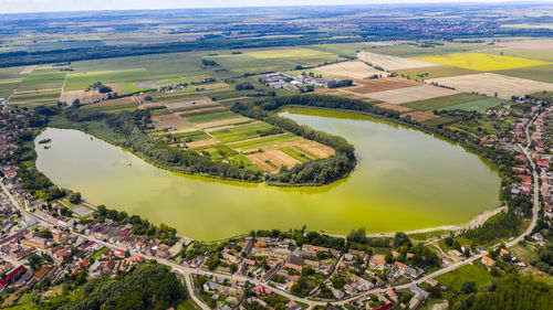 High angle view of river amidst field