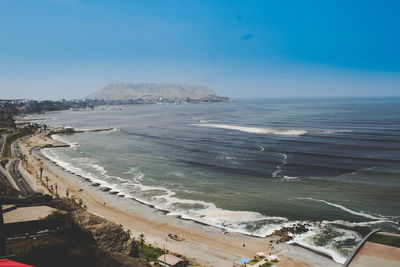 Scenic view of beach against clear sky