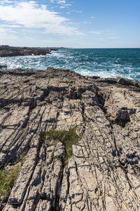 Rough and breathtaking sea. polignano a mare sunlit. puglia. italy