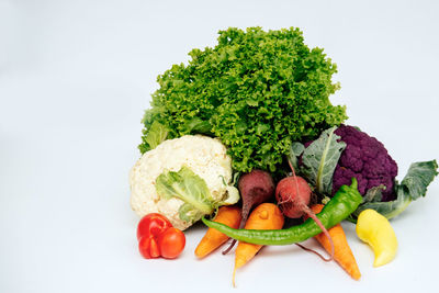 High angle view of fruits against white background