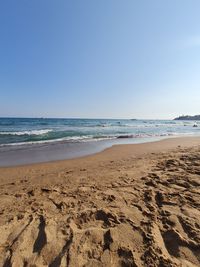 Scenic view of beach against clear sky