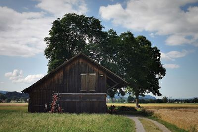 House on field against sky