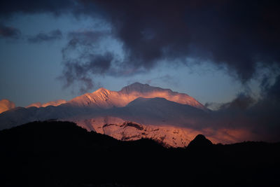 Scenic view of mountains against sky during sunset