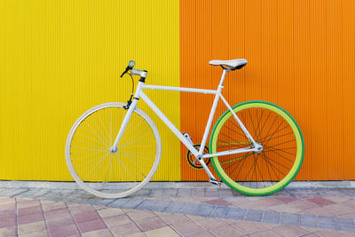 Bicycle parked against wall