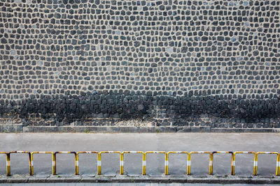 High angle view of footpath by railing