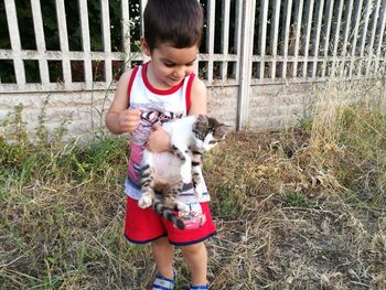 Boy with dog on grass