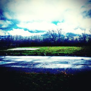 Scenic view of landscape against cloudy sky