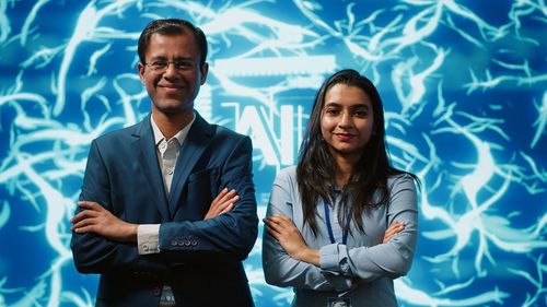Business colleagues standing against sky