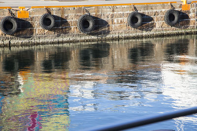 Reflection of multi colored boat in lake