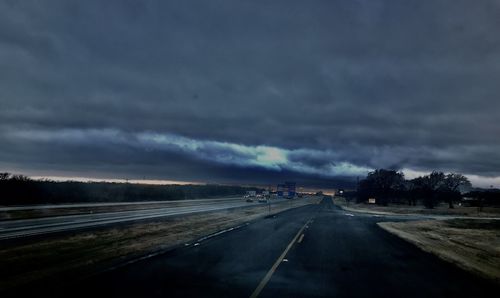 Storm clouds over road