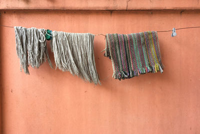 Clothes drying on wall