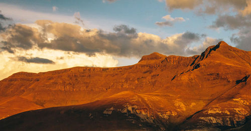 Scenic view of mountains against sky during sunset