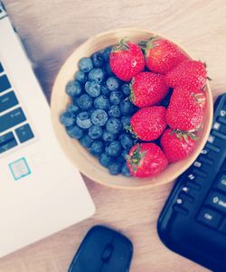 High angle view of strawberries on table