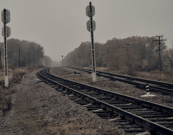 Railroad tracks against clear sky