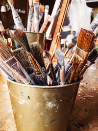 High angle view of paintbrushes in container on table