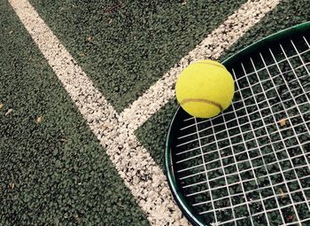 Tennis ball and racket