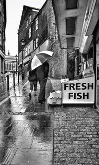 Full length of woman walking in city