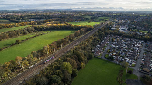 Aerial view of residential district against sky 