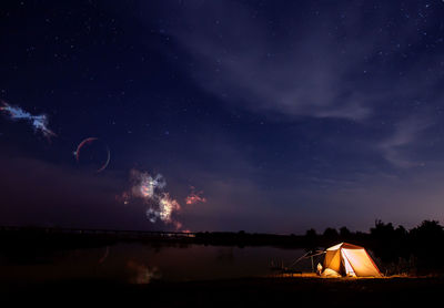 Scenic view of field against sky at night