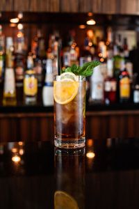 Close-up of rum cola in glass on table