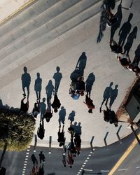 High angle view of people walking on road