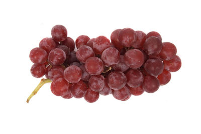 Close-up of grapes against white background