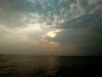 Scenic view of sea against sky at sunset