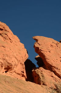 Low angle view of rock formation against sky